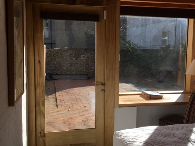 Accoya door & window seat. Architect: Donaghy + Dimond Door & window seat.